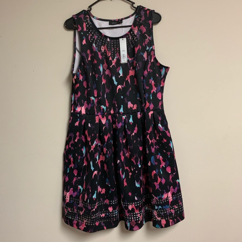 Pleated dress with detailed neck and hem line